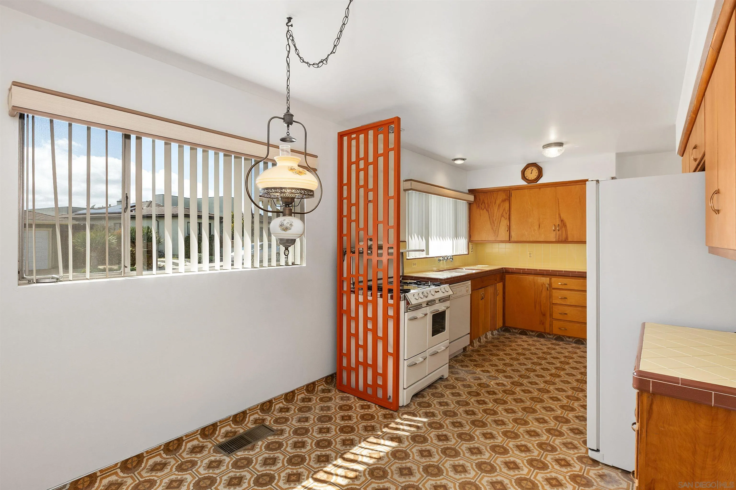 4552 Lucille Drive San Diego, CA 92115 - Photo 12 of 35 a kitchen with stainless steel appliances granite countertop a stove a sink and a refrigerator