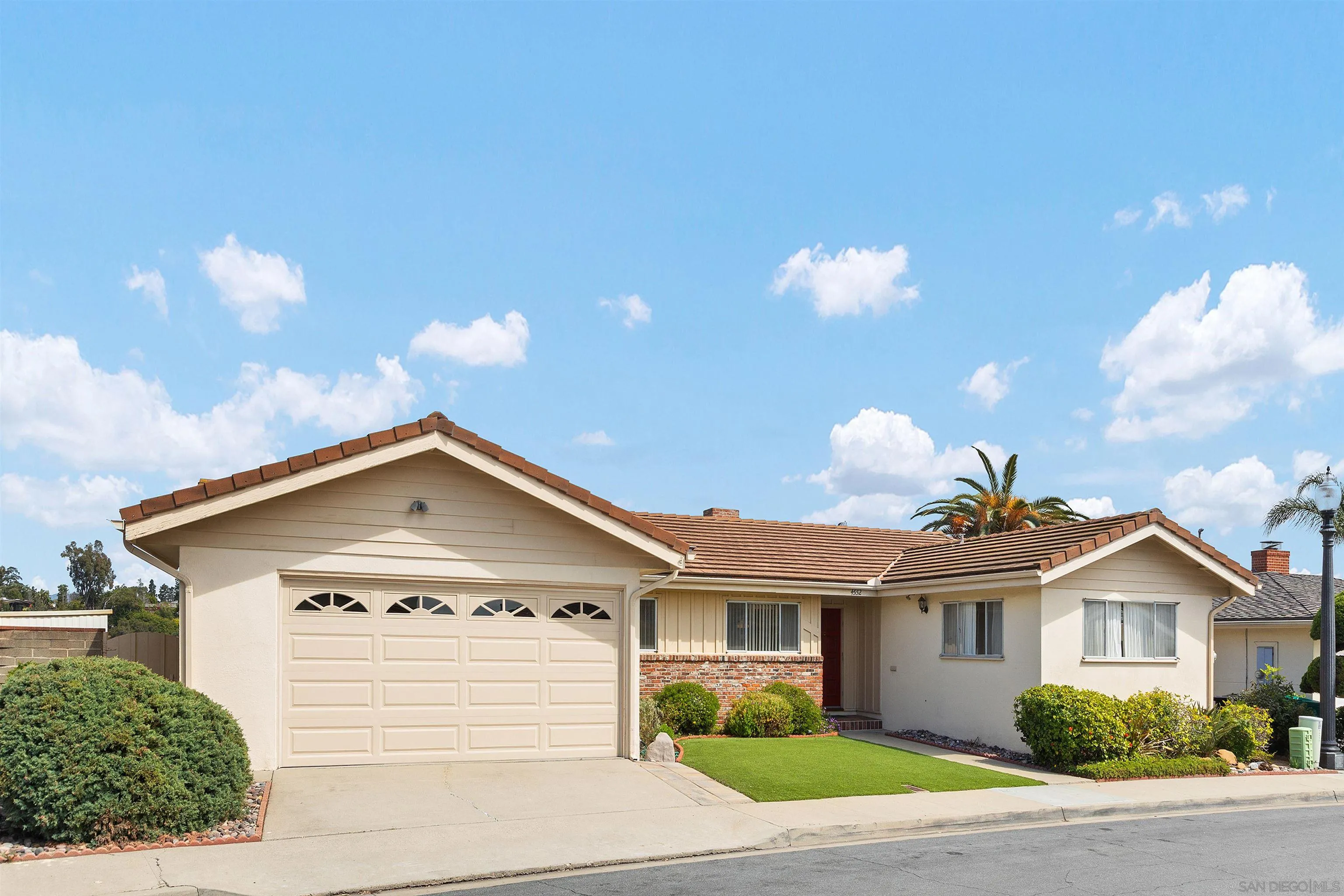 4552 Lucille Drive San Diego, CA 92115 - Photo 2 of 35 a view of a house with a yard