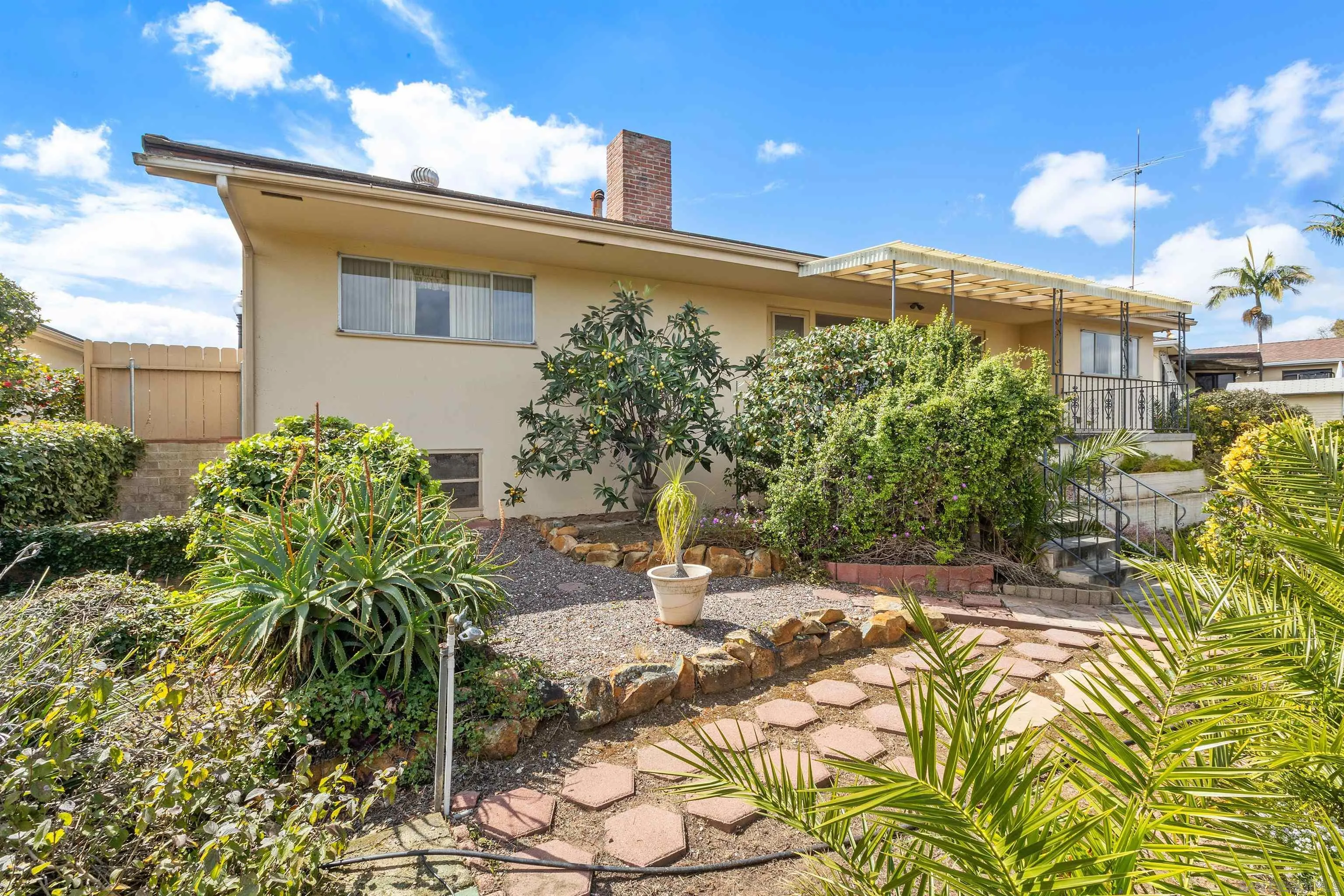 4552 Lucille Drive San Diego, CA 92115 - Photo 30 of 35 a patio with table and chairs and potted plants