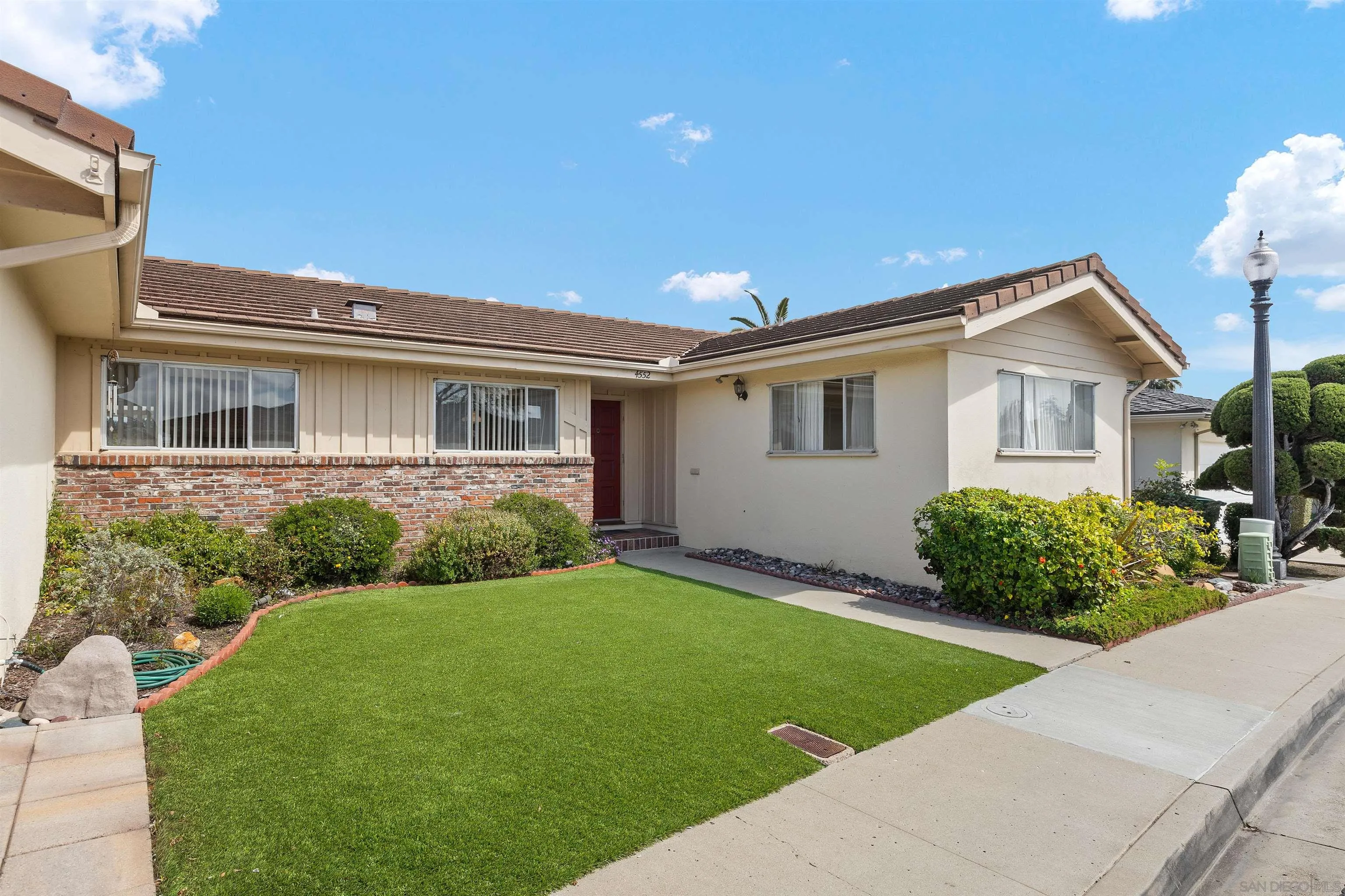 4552 Lucille Drive San Diego, CA 92115 - Photo 3 of 35 a front view of a house with garden