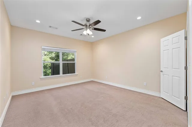 a bathroom with a granite countertop double vanity sink and mirror
