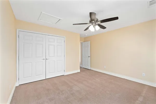 an empty room with a empty space and windows