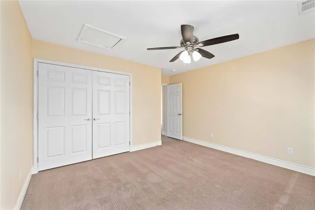 an empty room with a empty space and windows