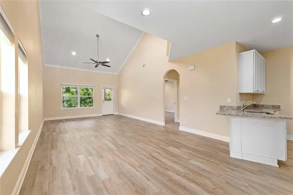 a view of a kitchen with a sink and a window