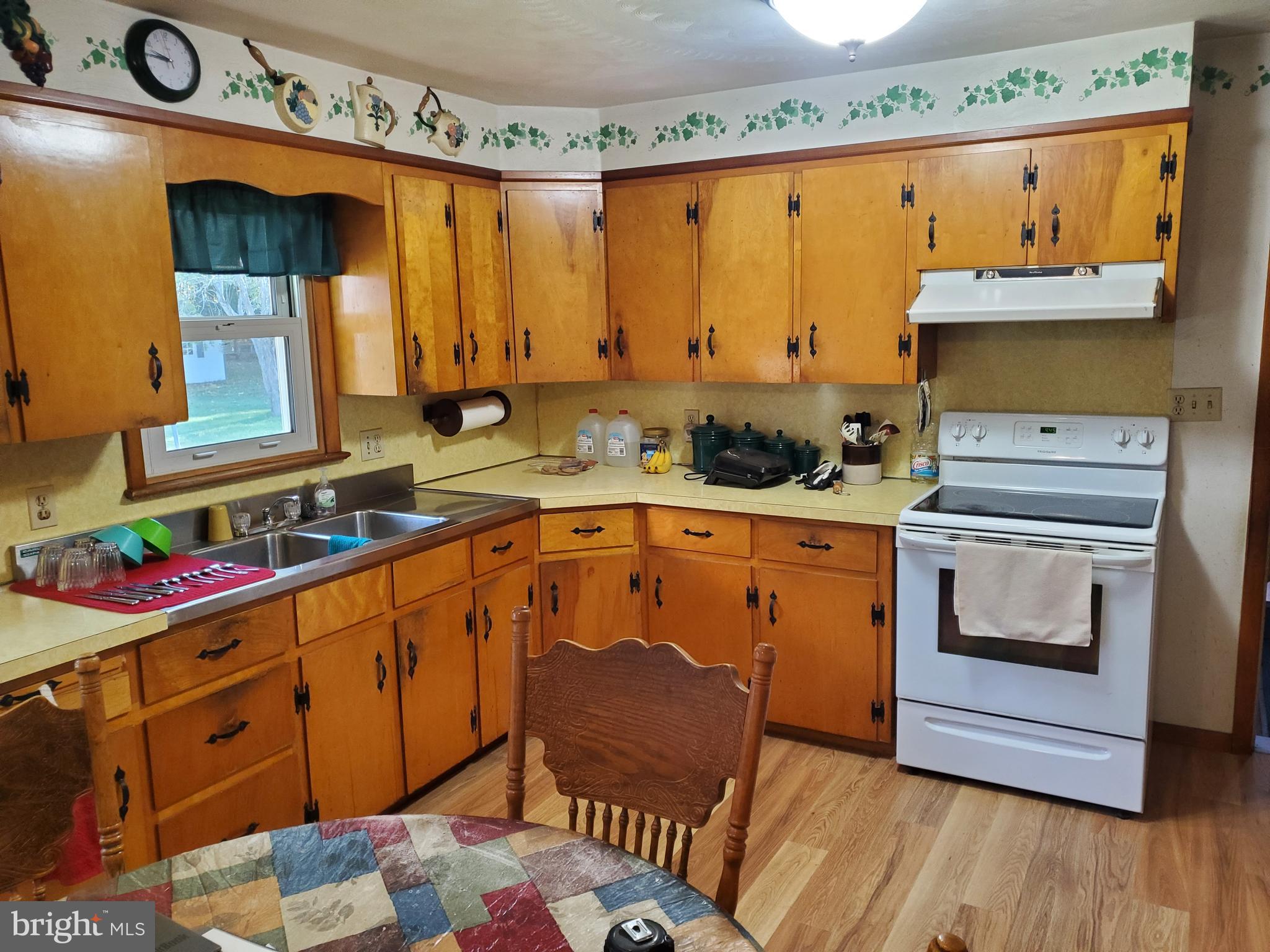 161 Pike Road Howard, PA 16841 - Photo 4 of 15 a kitchen with stainless steel appliances a stove a sink and a microwave