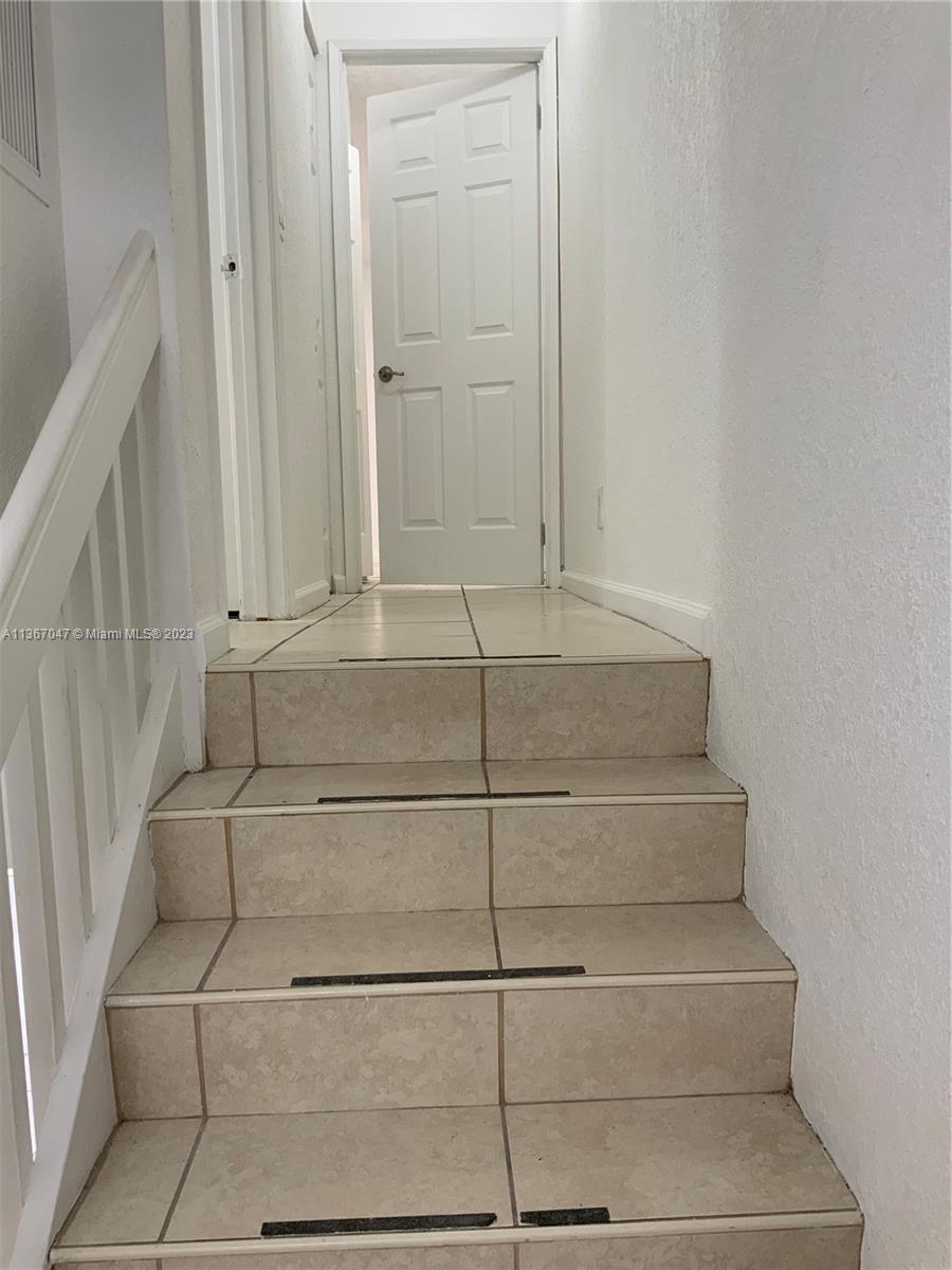 8110 Severn Drive, Unit C Boca Raton, FL 33433 - Photo 11 of 31 a view of staircase with white walls