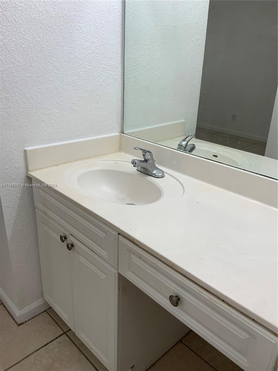 8110 Severn Drive, Unit C Boca Raton, FL 33433 - Photo 13 of 31 a close view of sink and tap
