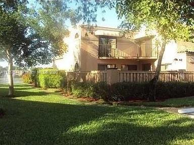 8110 Severn Drive, Unit C Boca Raton, FL 33433 - Photo 20 of 31 a view of a house with a yard and sitting area