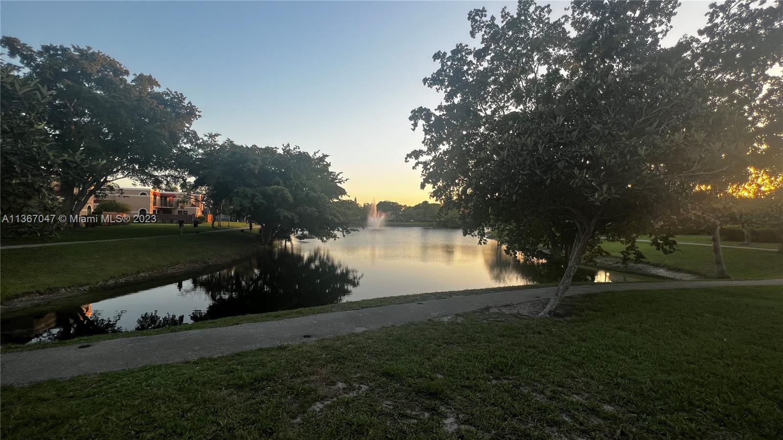 8110 Severn Drive, Unit C Boca Raton, FL 33433 - Photo 26 of 31 a view of a lake with houses in background