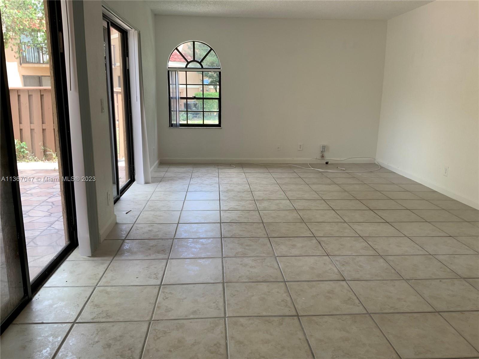 8110 Severn Drive, Unit C Boca Raton, FL 33433 - Photo 8 of 31 a view of an empty room and window