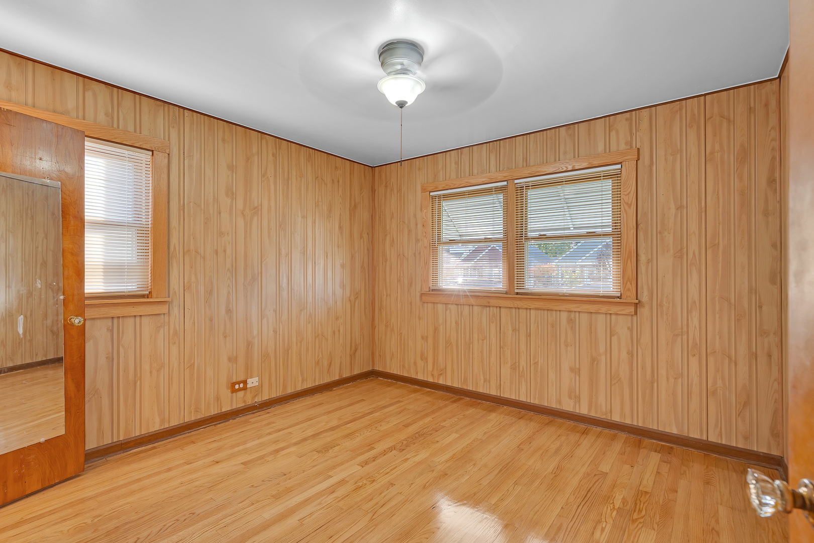 31 46th Avenue Bellwood, IL 60104 - Photo 12 of 30 a view of an empty room with a window and wooden floor