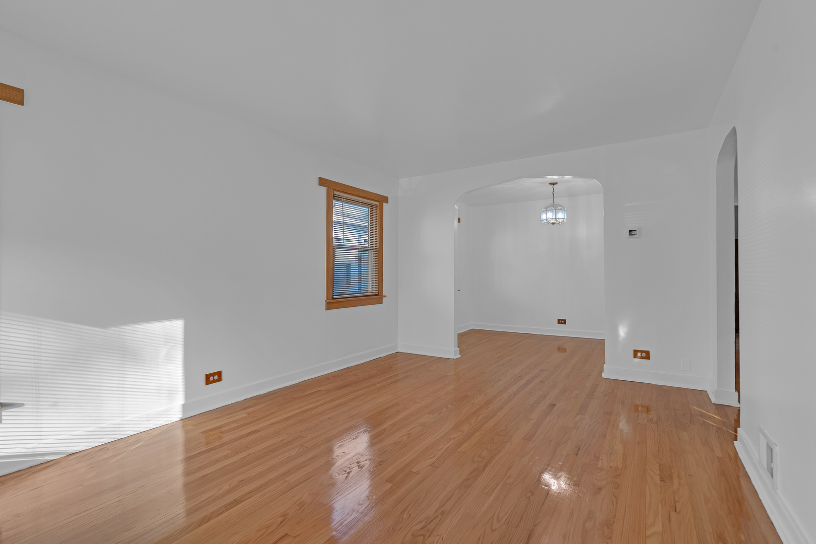 31 46th Avenue Bellwood, IL 60104 - Photo 2 of 30 a view of a room with wooden floor and window