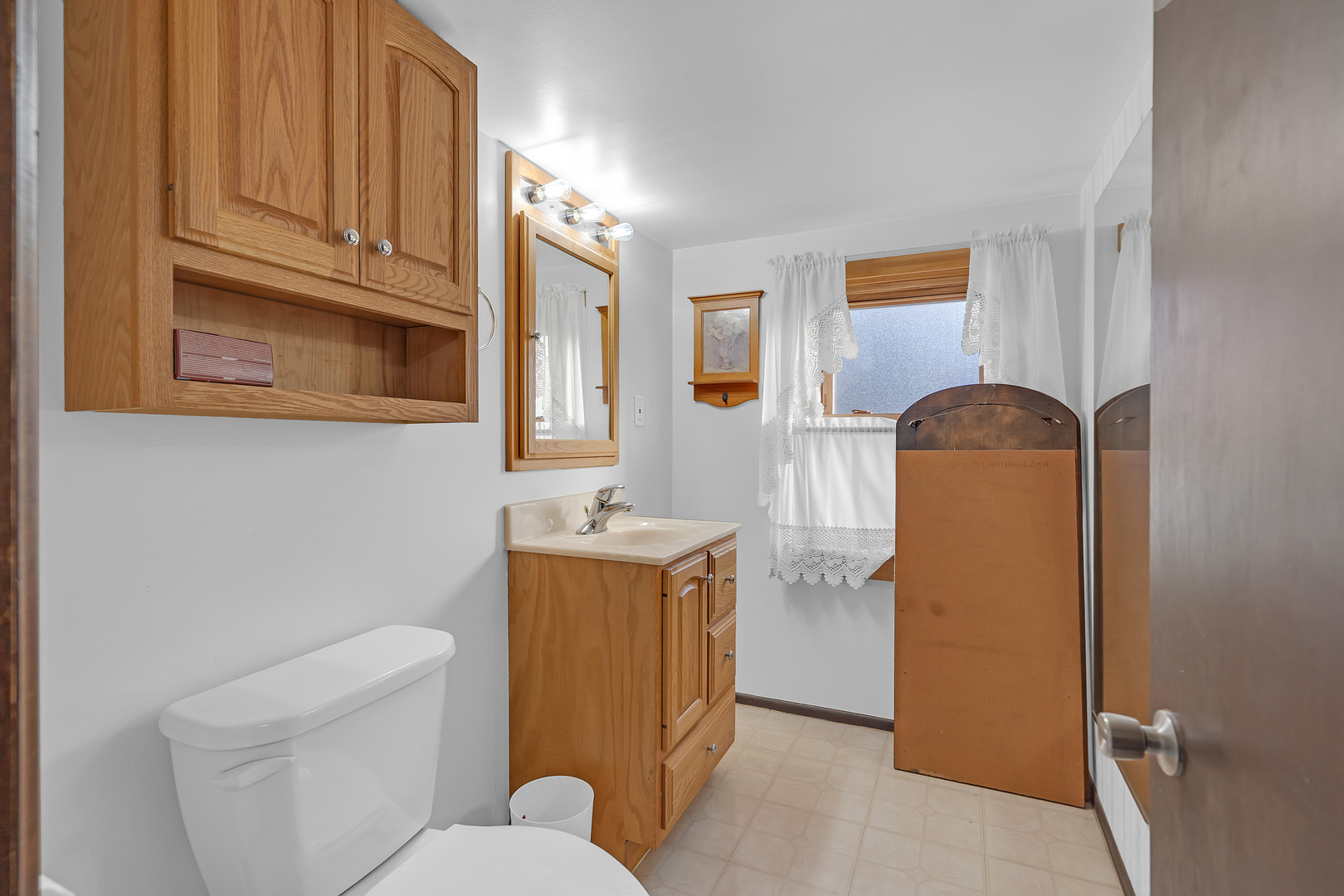 31 46th Avenue Bellwood, IL 60104 - Photo 24 of 30 a bathroom with a sink toilet and mirror