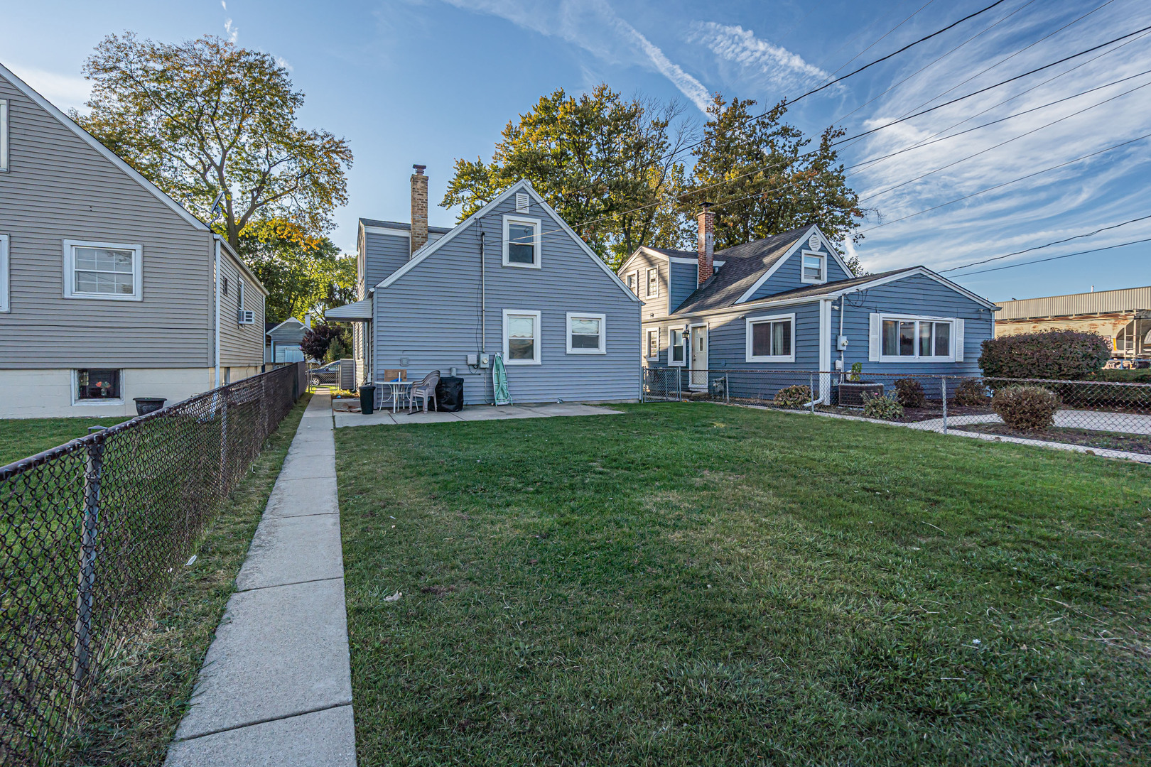 31 46th Avenue Bellwood, IL 60104 - Photo 30 of 30 a front view of a house with a garden and trees