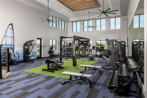 a kitchen with a sink dining table and chairs