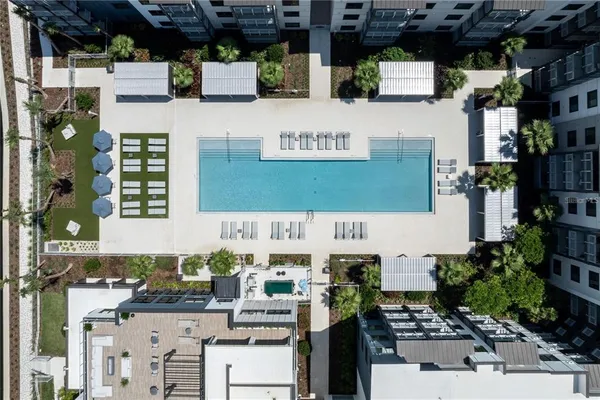 a view of a garden with wooden deck