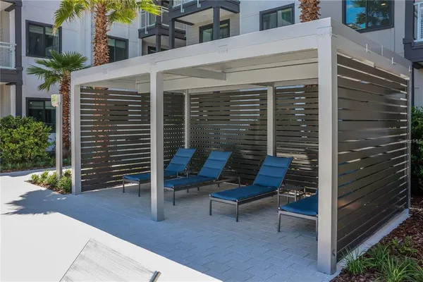 a view of a garden with furniture