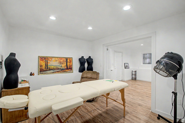 12645 East Cedar Ridge Drive Fairview, UT 84629 - Photo 20 of 34 Spacious room featuring wood-finish flooring, recessed lighting, and a wide entryway to an additional room