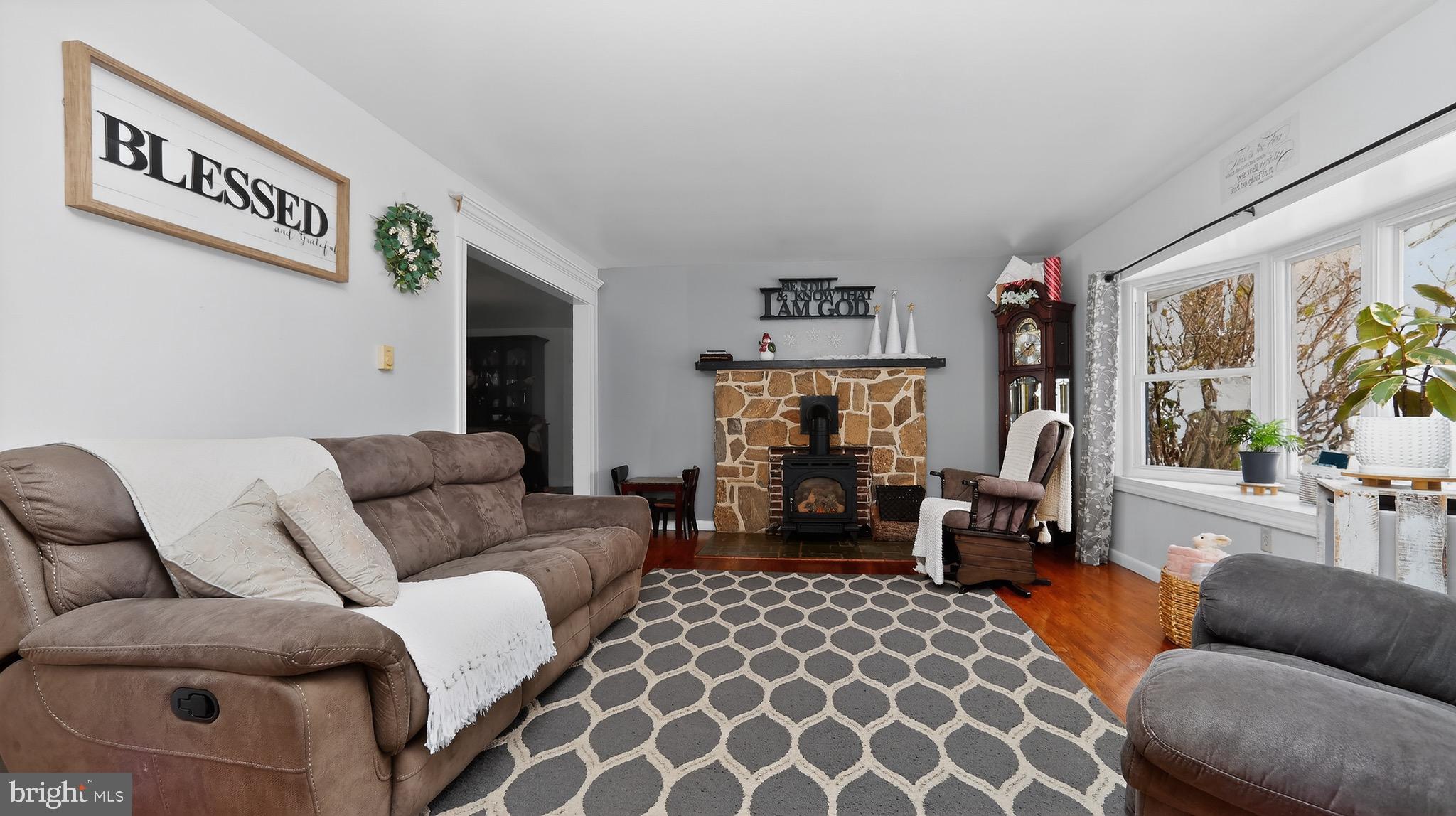 513 Jacobs Road Narvon, PA 17555 - Photo 14 of 69 a living room with furniture a fireplace and a large window