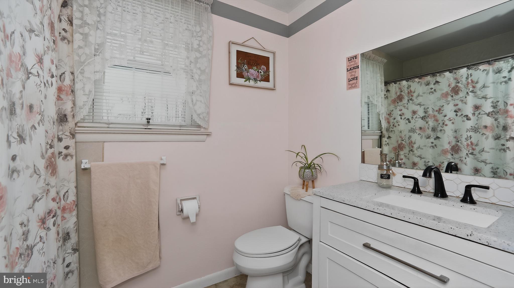 513 Jacobs Road Narvon, PA 17555 - Photo 16 of 69 a bathroom with a granite countertop sink toilet and a mirror