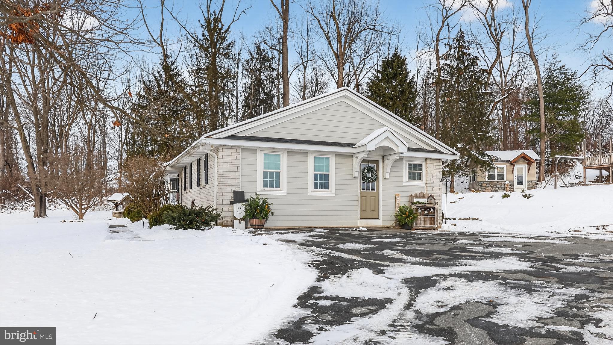 513 Jacobs Road Narvon, PA 17555 - Photo 41 of 69 a front view of a house with a yard covered in snow