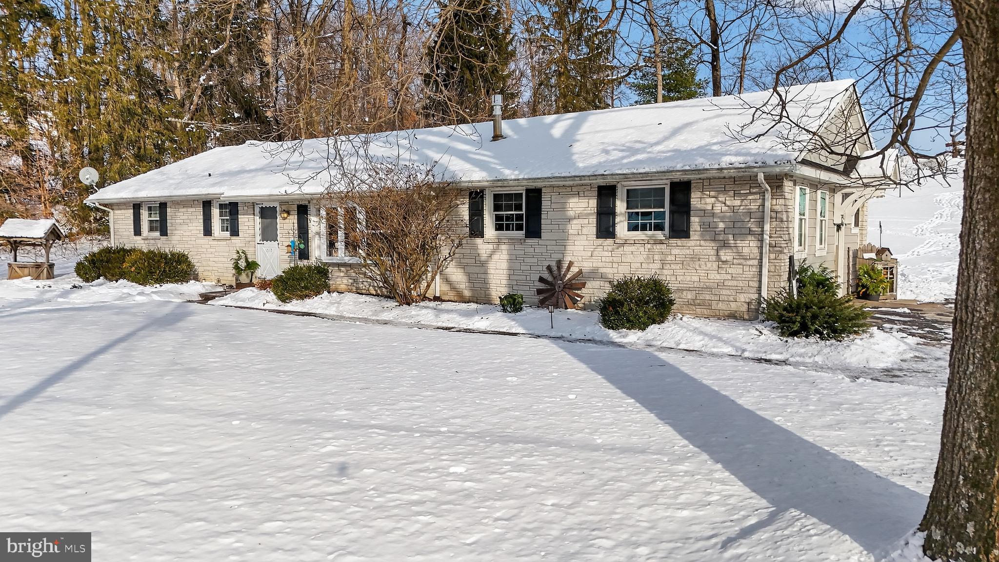 513 Jacobs Road Narvon, PA 17555 - Photo 60 of 69 a front view of a house with a yard and potted plants
