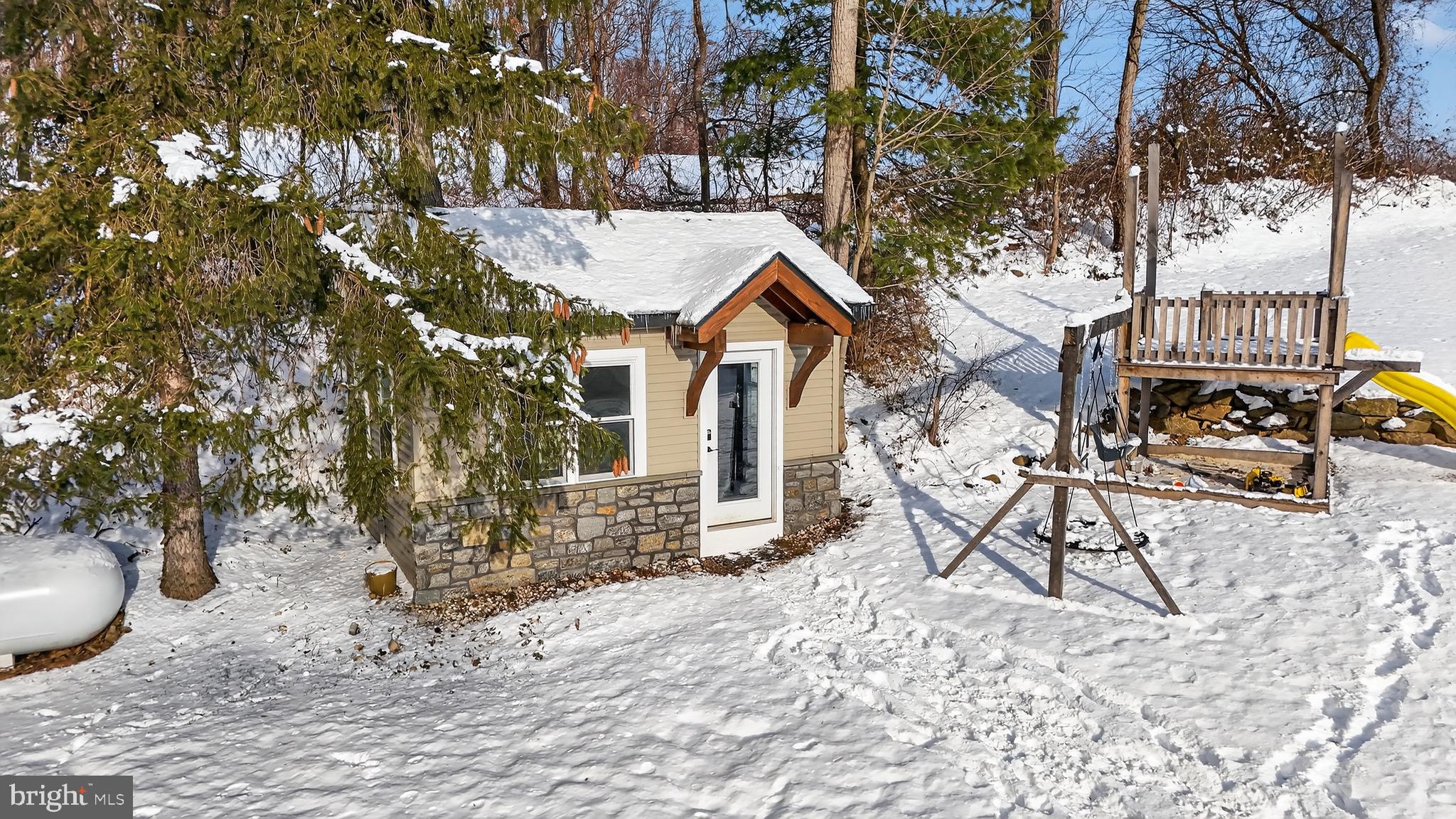 513 Jacobs Road Narvon, PA 17555 - Photo 67 of 69 a view of a backyard with table and chairs and potted plants