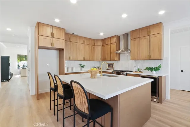 a kitchen with a stove a refrigerator and a dining table
