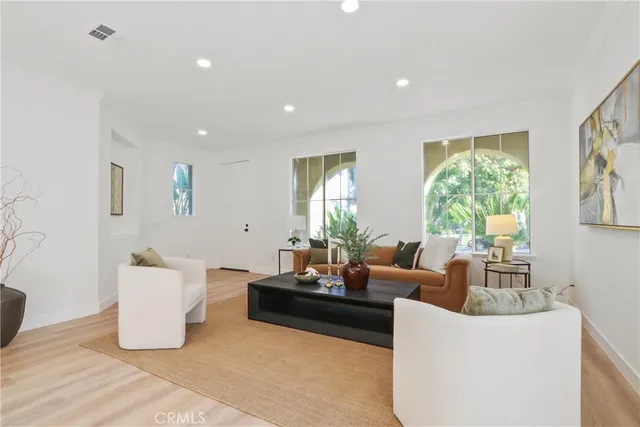 a living room with furniture and window