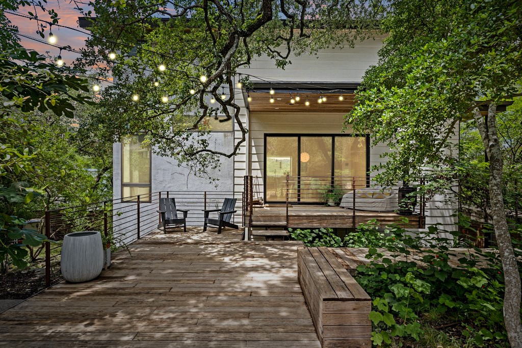 801 The High Road Austin, TX 78746 - Photo 40 of 40 a front view of a house with garden