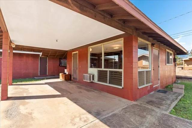 a view of a house with an empty space and windows