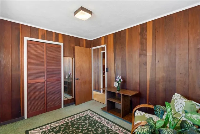 a view of a room with wooden walls