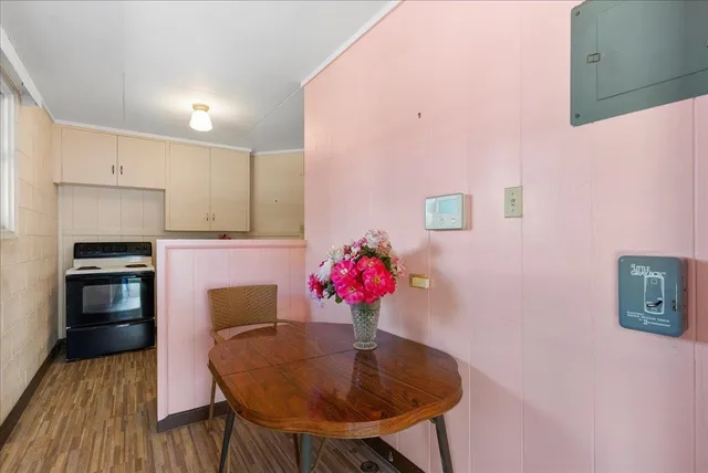 a dining room with furniture and wooden floor