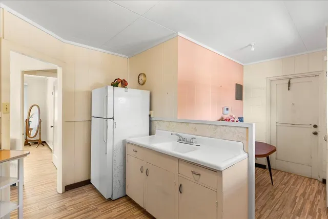 a bathroom with a sink vanity and a mirror