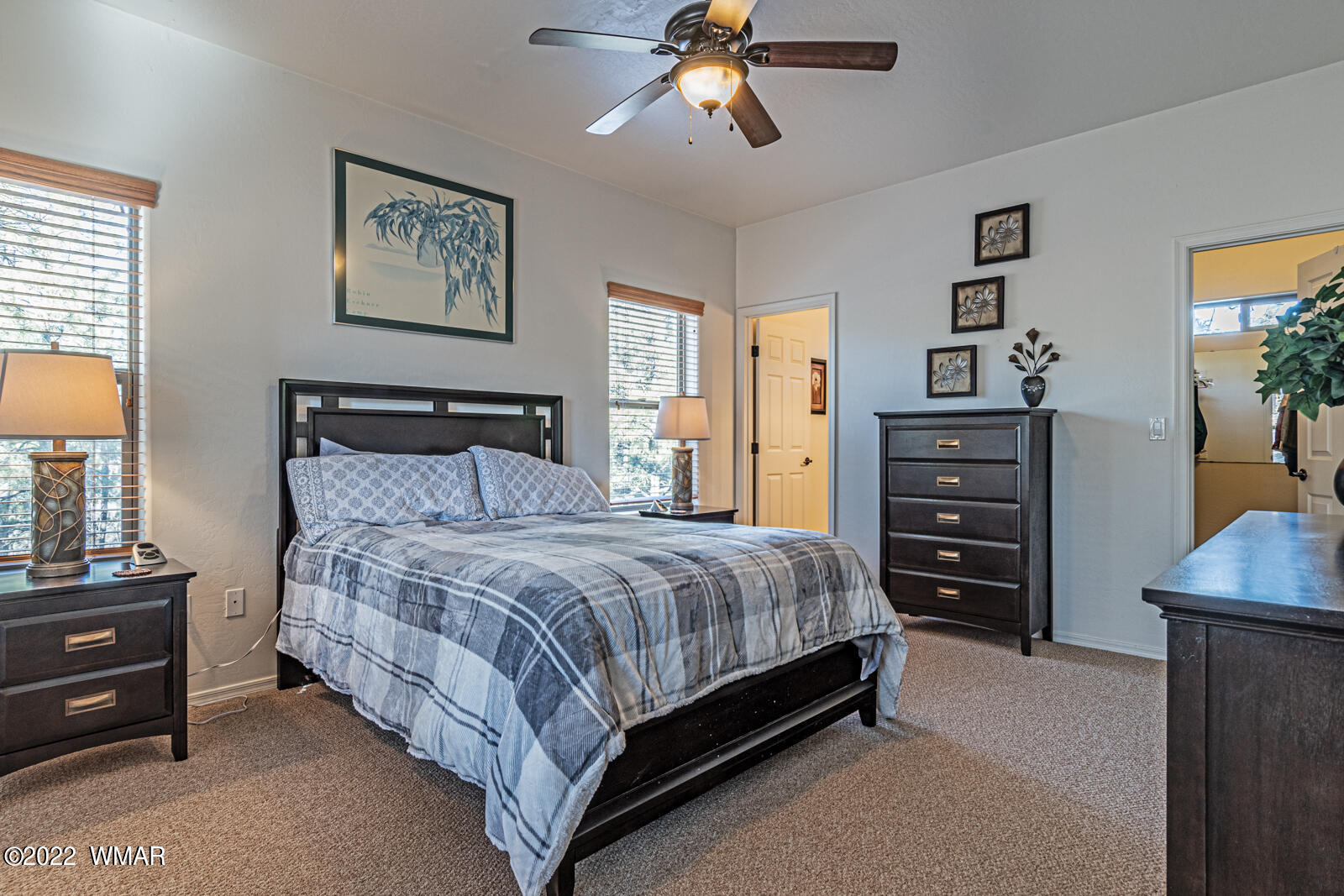 931 Cedar Ridge Run Show Low, AZ 85901 - Photo 12 of 20 a bedroom with a bed and a chandelier