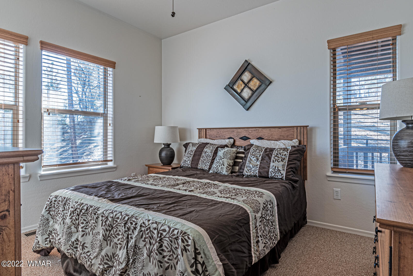 931 Cedar Ridge Run Show Low, AZ 85901 - Photo 15 of 20 a large bed sitting in a bedroom next to a window