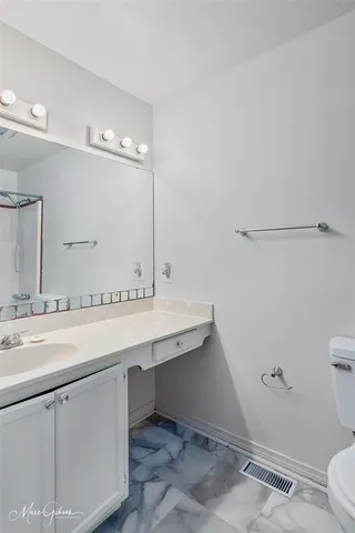 a bathroom with a sink and mirror