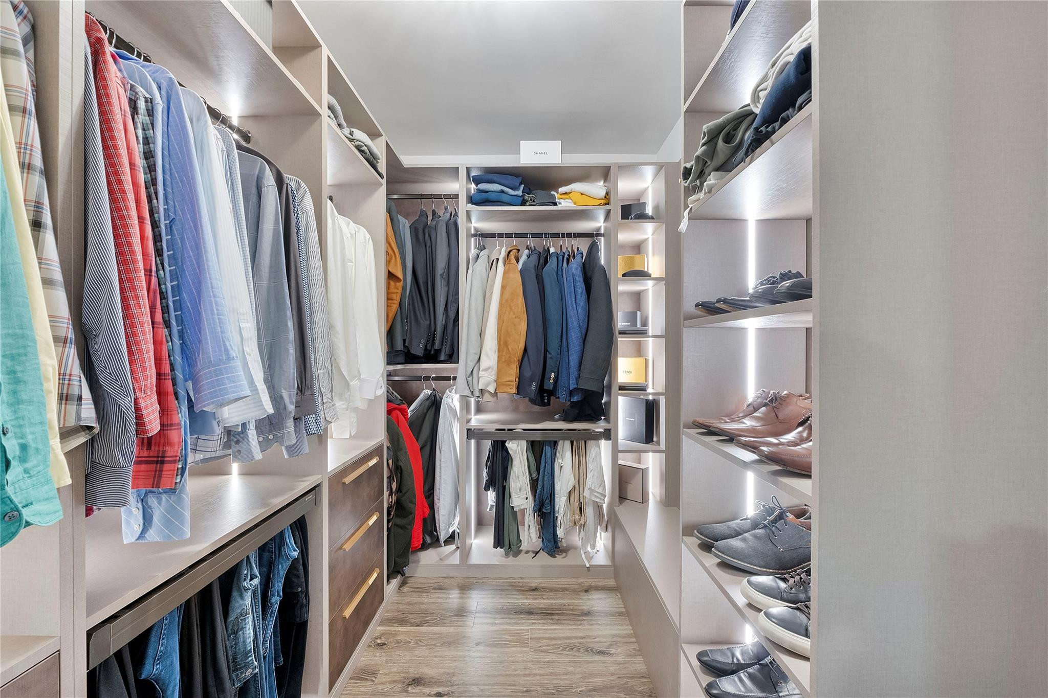 5351 Godfrey Road Parkland, FL 33067 - Photo 41 of 95 a view of walk in closet with clothes and shoes