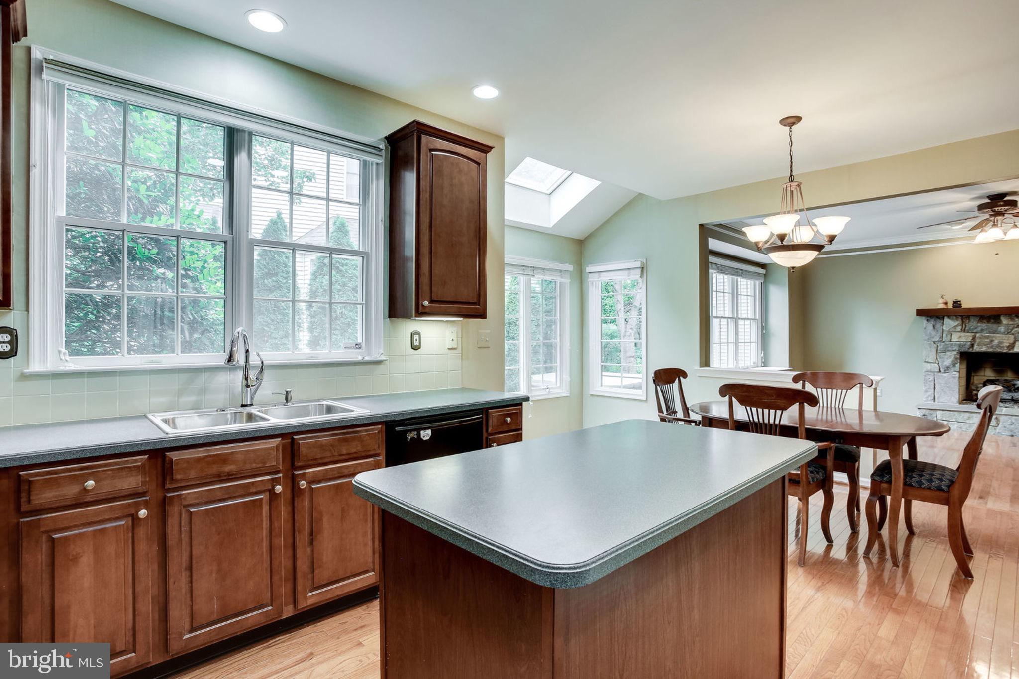 10851 Grovehampton Court Reston, VA 20194 - Photo 13 of 49 a kitchen with center island table and chairs