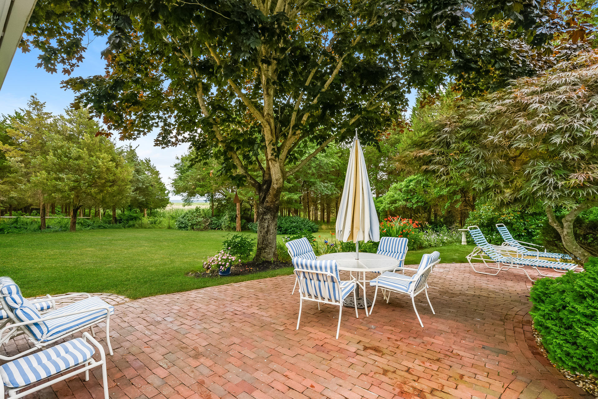 160 Point Hill Road West Barnstable, MA 02668 - Photo 27 of 39 a view of a table and chairs in the garden