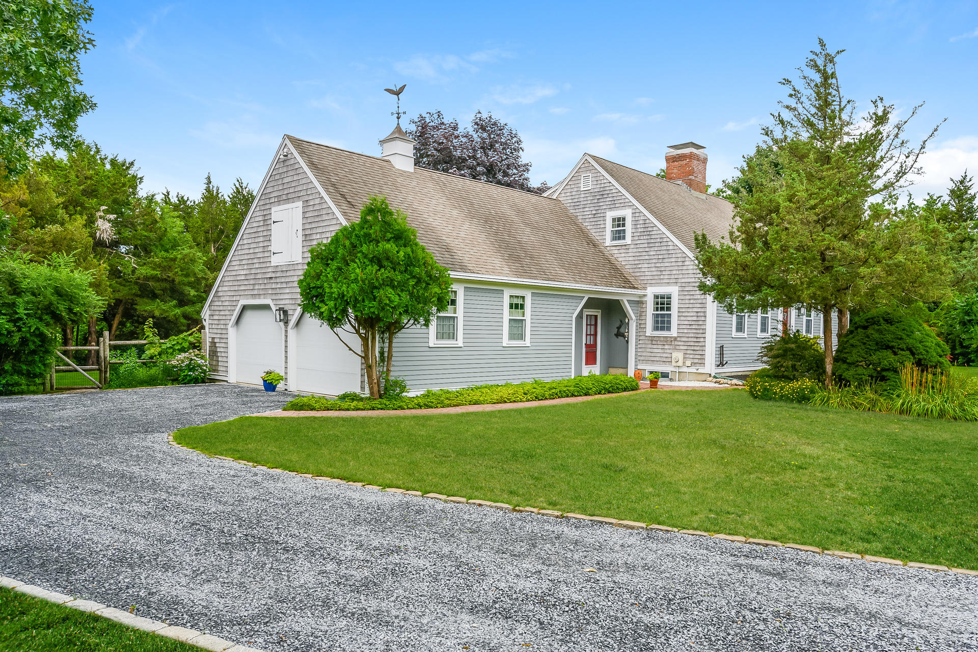 160 Point Hill Road West Barnstable, MA 02668 - Photo 5 of 39 a front view of a house with a yard and garage