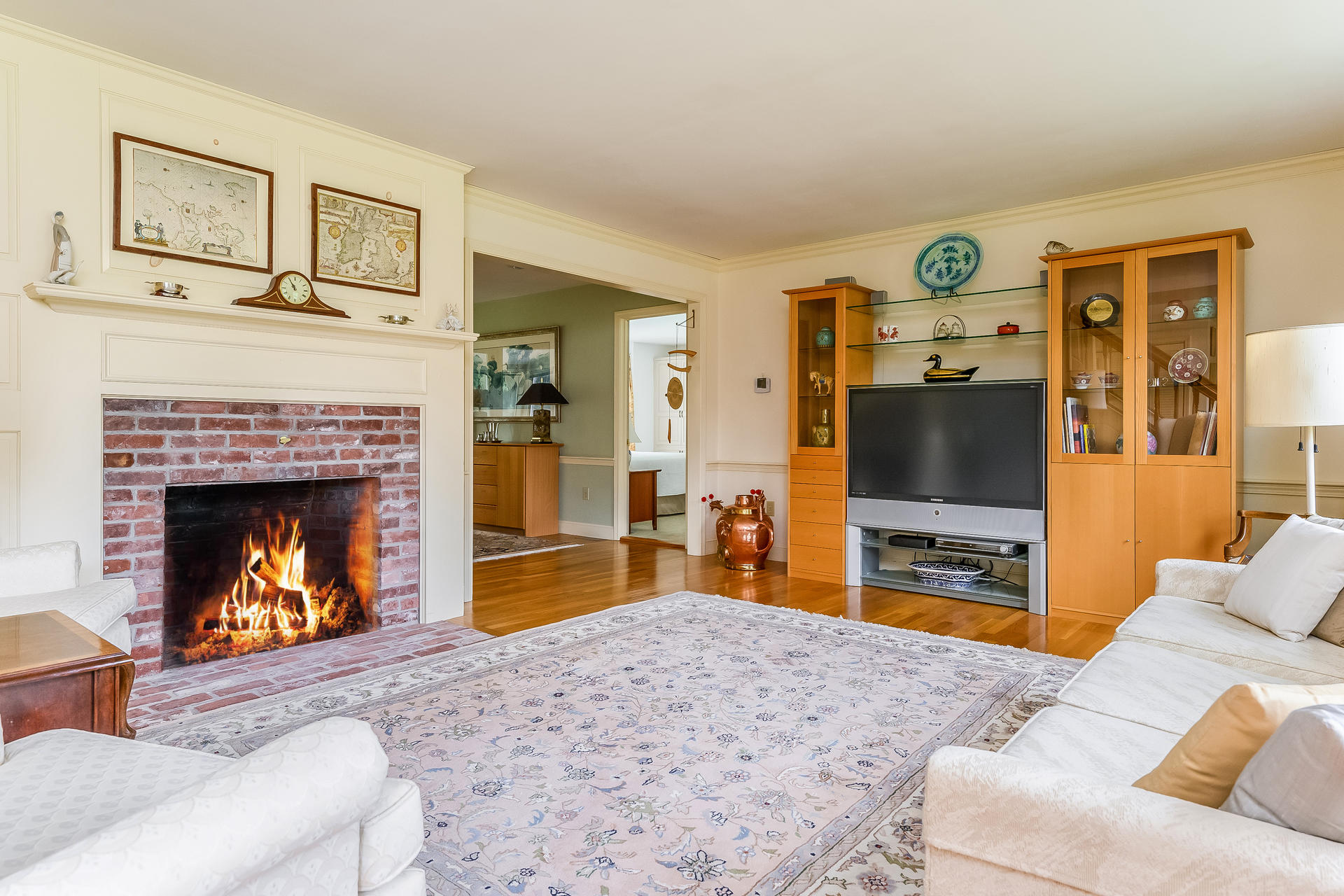 160 Point Hill Road West Barnstable, MA 02668 - Photo 7 of 39 a living room with furniture a flat screen tv and a fireplace