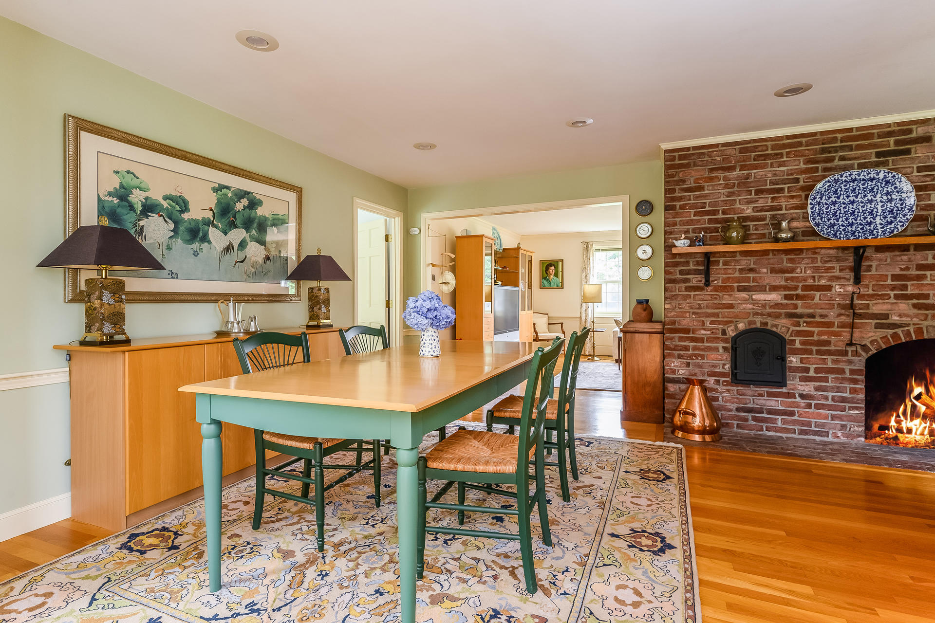 160 Point Hill Road West Barnstable, MA 02668 - Photo 9 of 39 a dining room with fireplace furniture and wooden floor