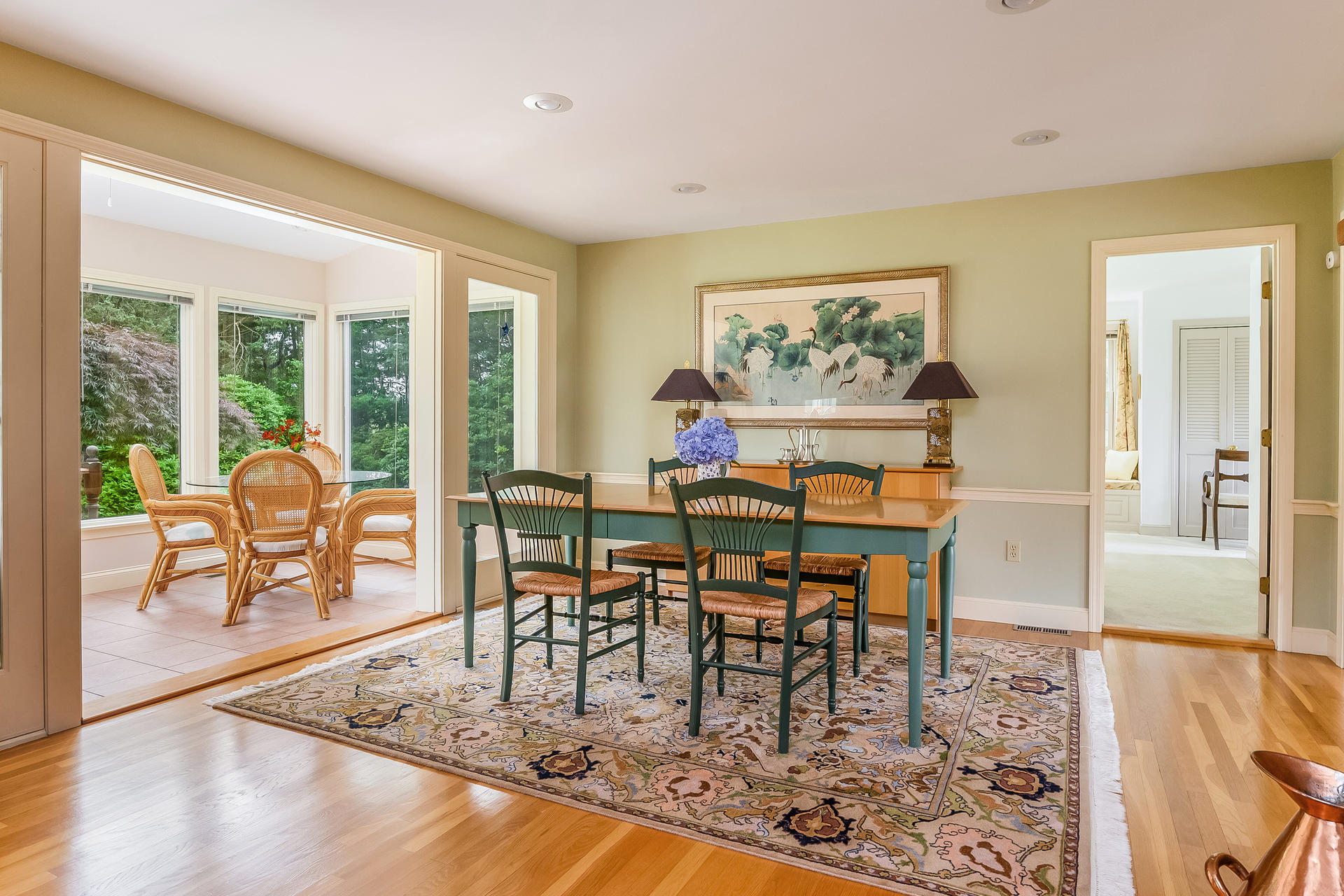 160 Point Hill Road West Barnstable, MA 02668 - Photo 10 of 39 a dining room with wooden floor and a floor to ceiling window