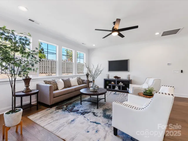 a spacious bathroom with a double vanity sink a mirror and a bathtub