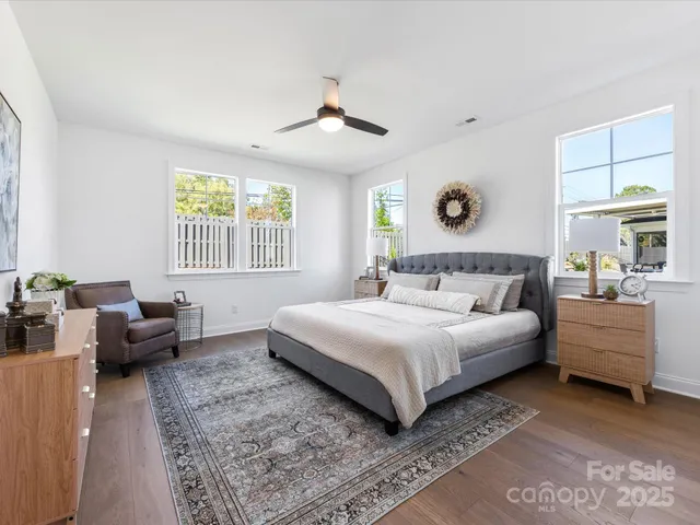 en empty room with window and ceiling fan