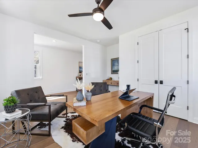 a kitchen with stainless steel appliances a sink a stove a refrigerator and island