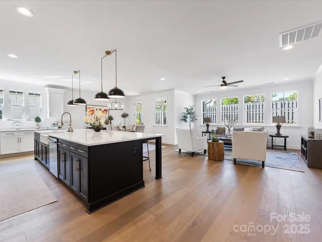 a kitchen with stainless steel appliances granite countertop a sink and cabinets