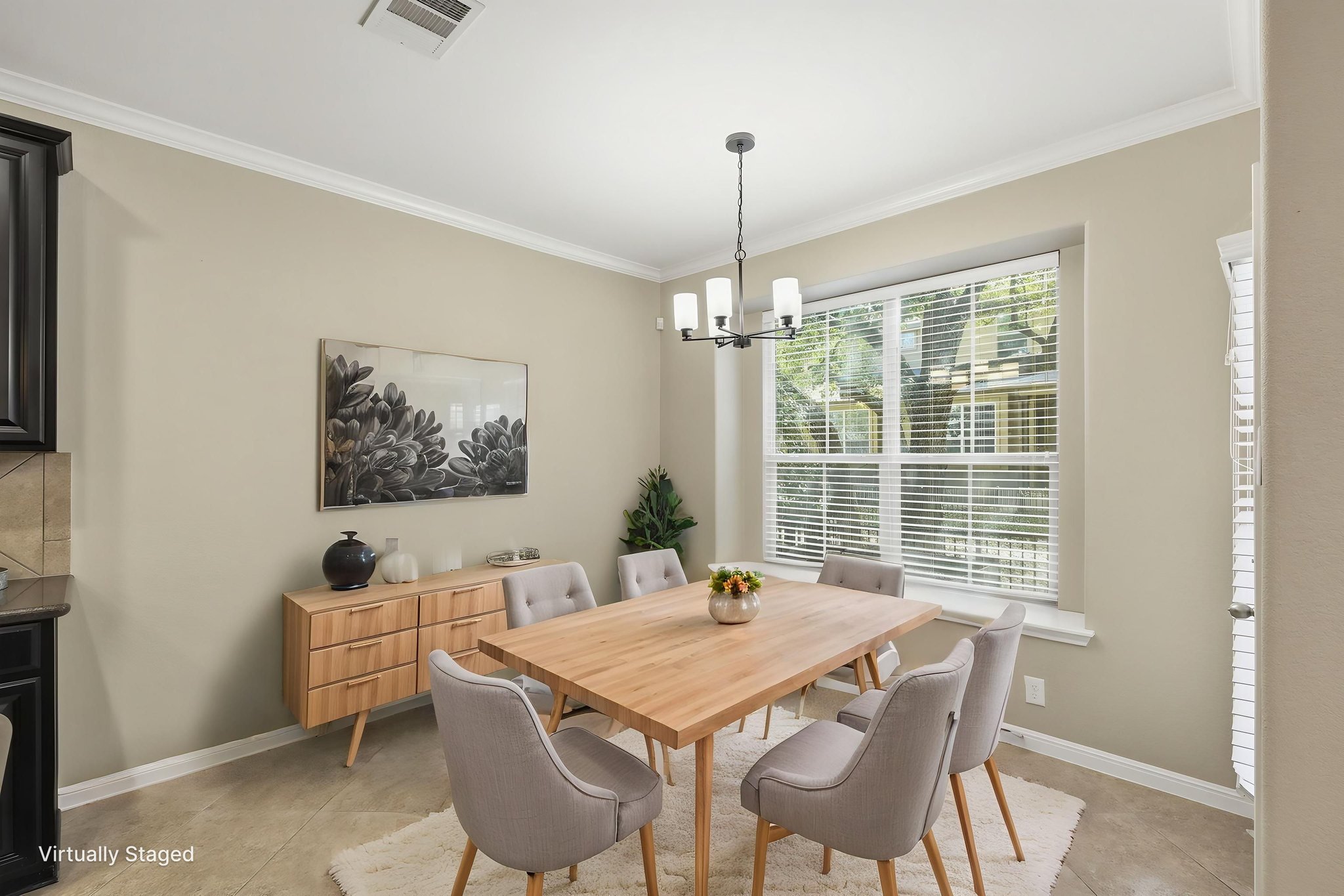 14001 Avery Ranch Boulevard, Unit 602 Austin, TX 78717 - Photo 9 of 39 VIRTUALLY STAGED Dining room featuring crown molding and a chandelier