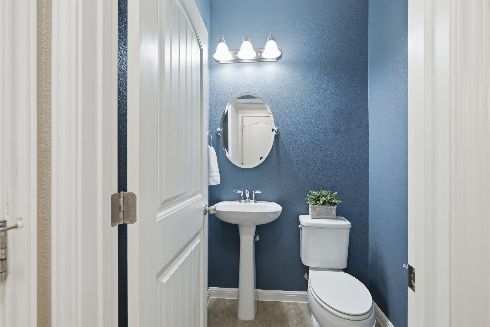 14001 Avery Ranch Boulevard, Unit 602 Austin, TX 78717 - Photo 23 of 39 Half bathroom with toilet and a textured wall downstairs